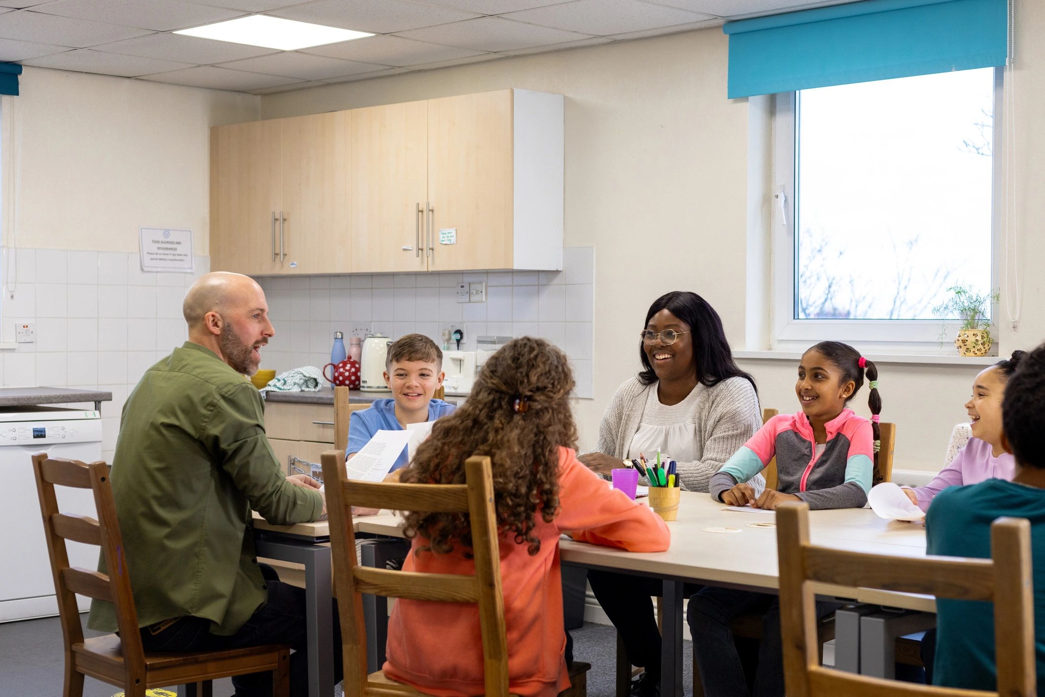 Children and adults in a supportive community learning setting