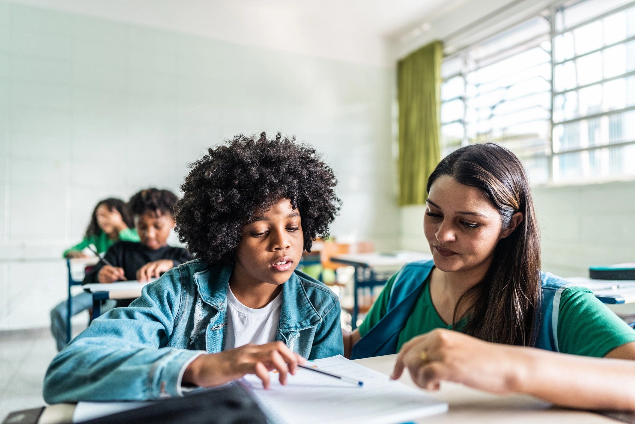 Educator working one-on-one with a student